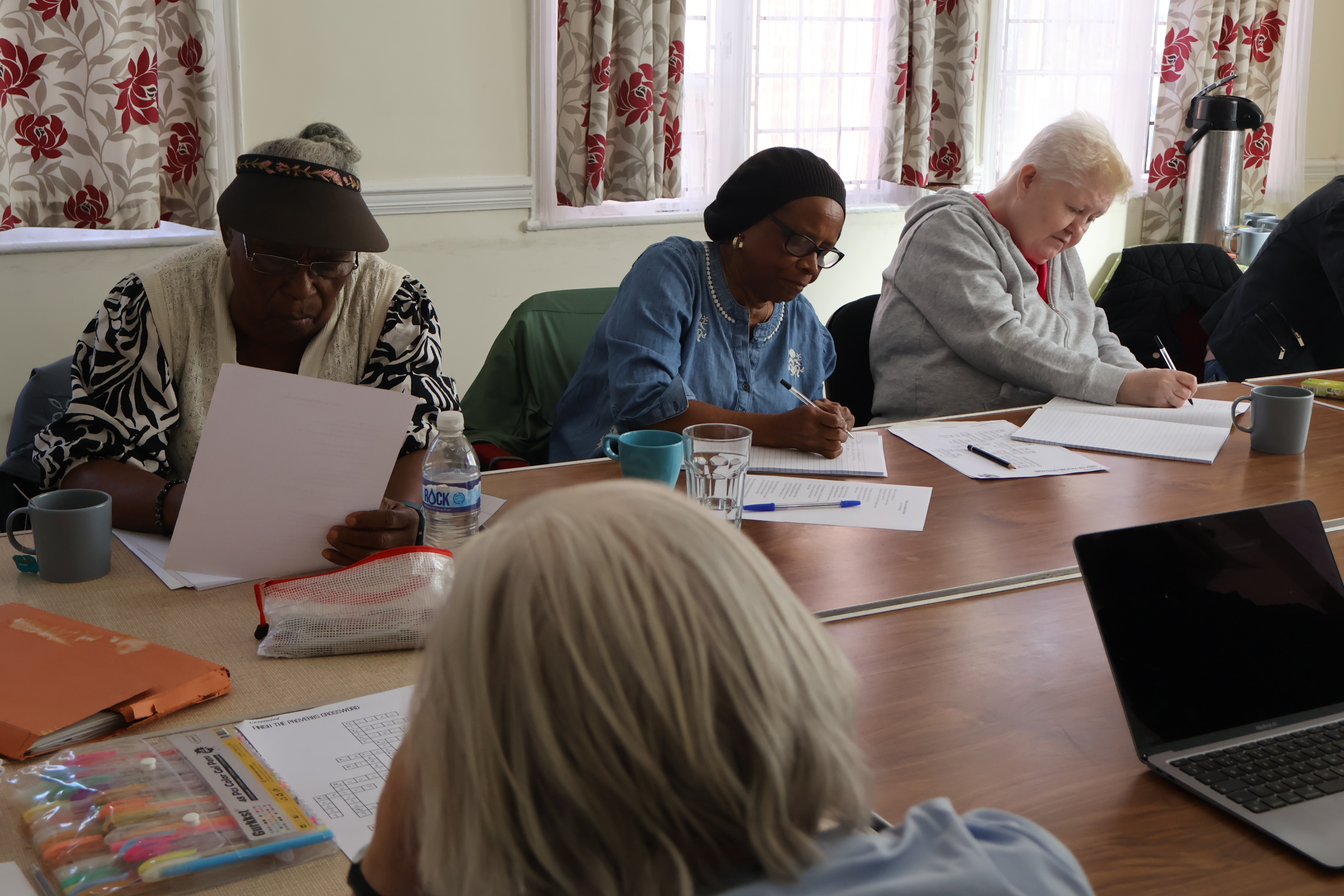 A group of older women in an art:links writing workshop. art:links if our programme for older adults.