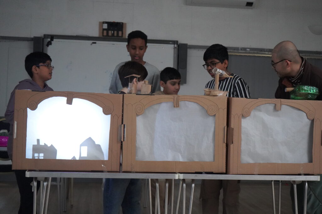 Young carers performing at a puppetry project.