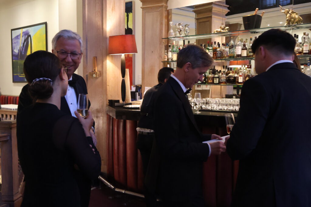 Guests talking at a black tie Create annual Gala.