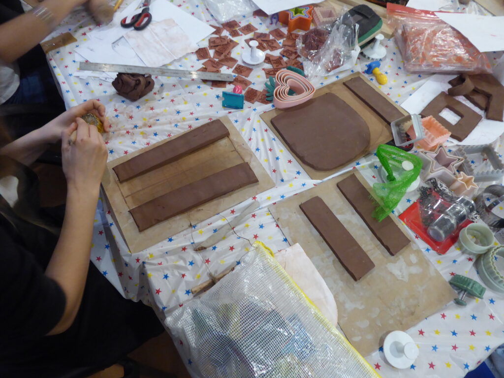 Young carers taking part in a ceramics project.