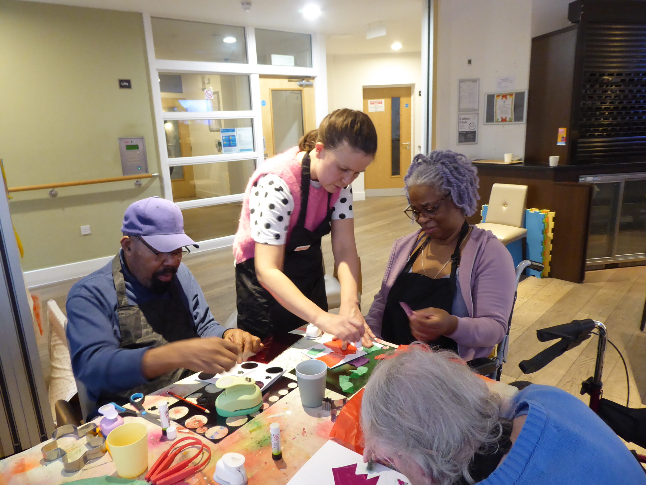 Older adults taking part in a visual arts workshop