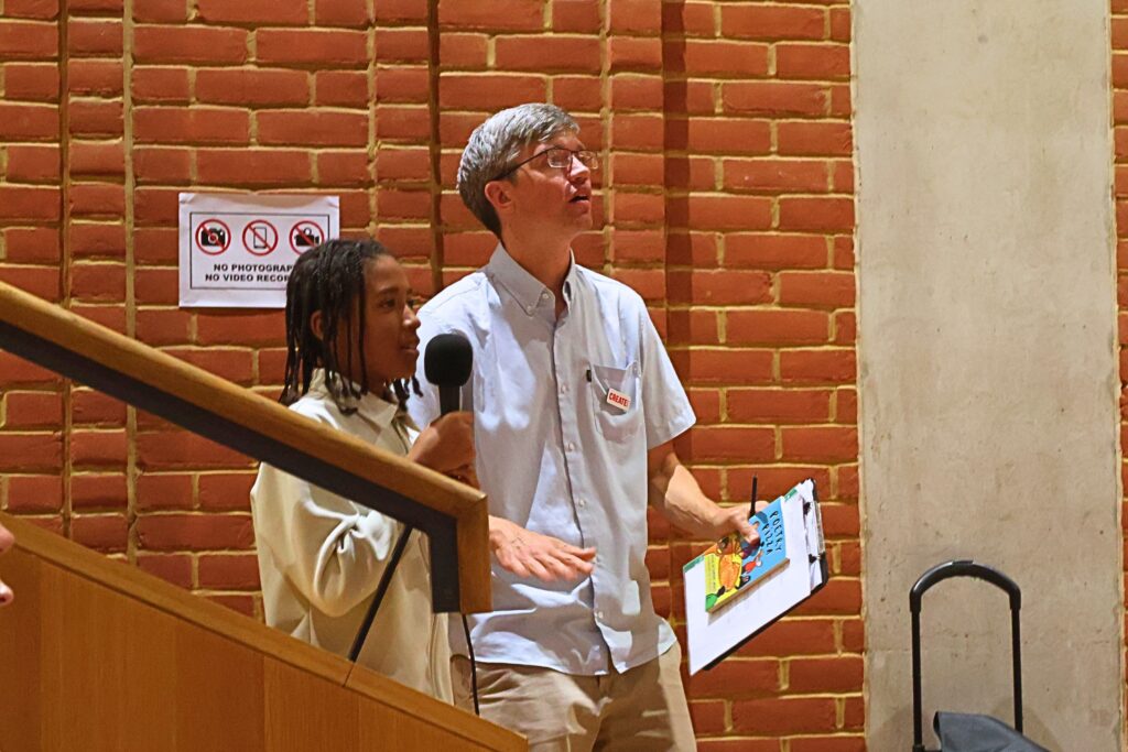 Young carers reading their poem at the inspired:arts showcase in Hammersmith.